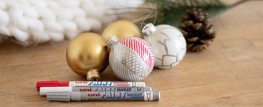 Beautiful Christmas baubles customised with Uni Paint Markers