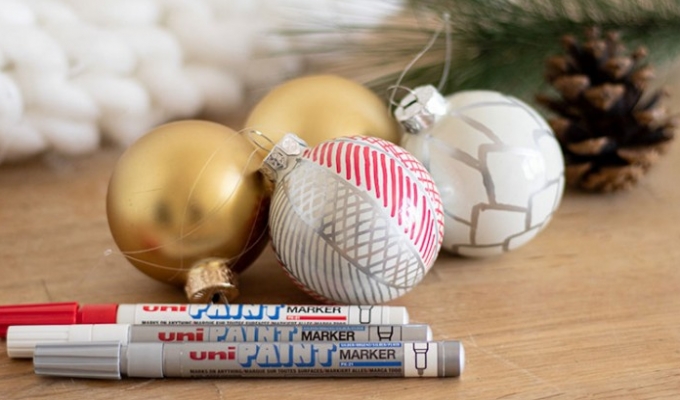 Beautiful Christmas baubles customised with Uni Paint Markers